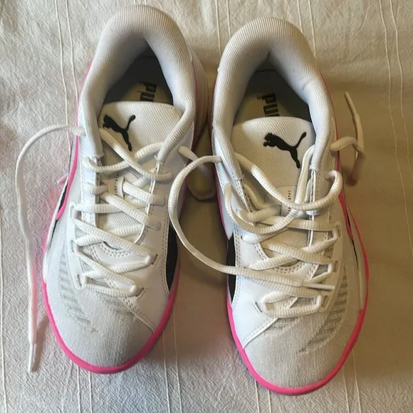 Pink, White, and black Puma basketball shoes. Size 4 in kids.